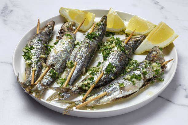 Sardinha assada com limão e ervas